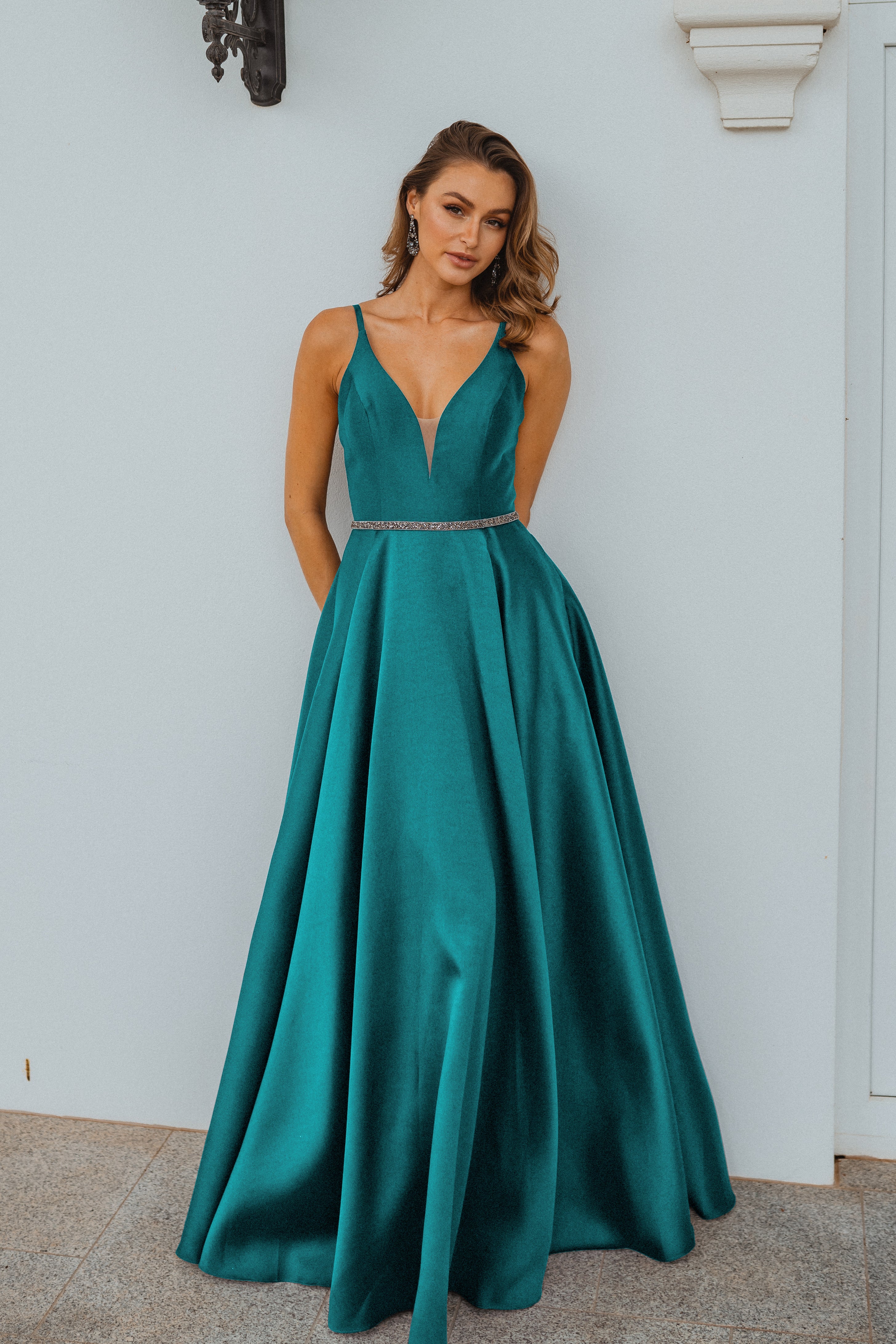 PO896 Linz front of emerald green plunging v neckline, floor length a line, matte satin formal dress