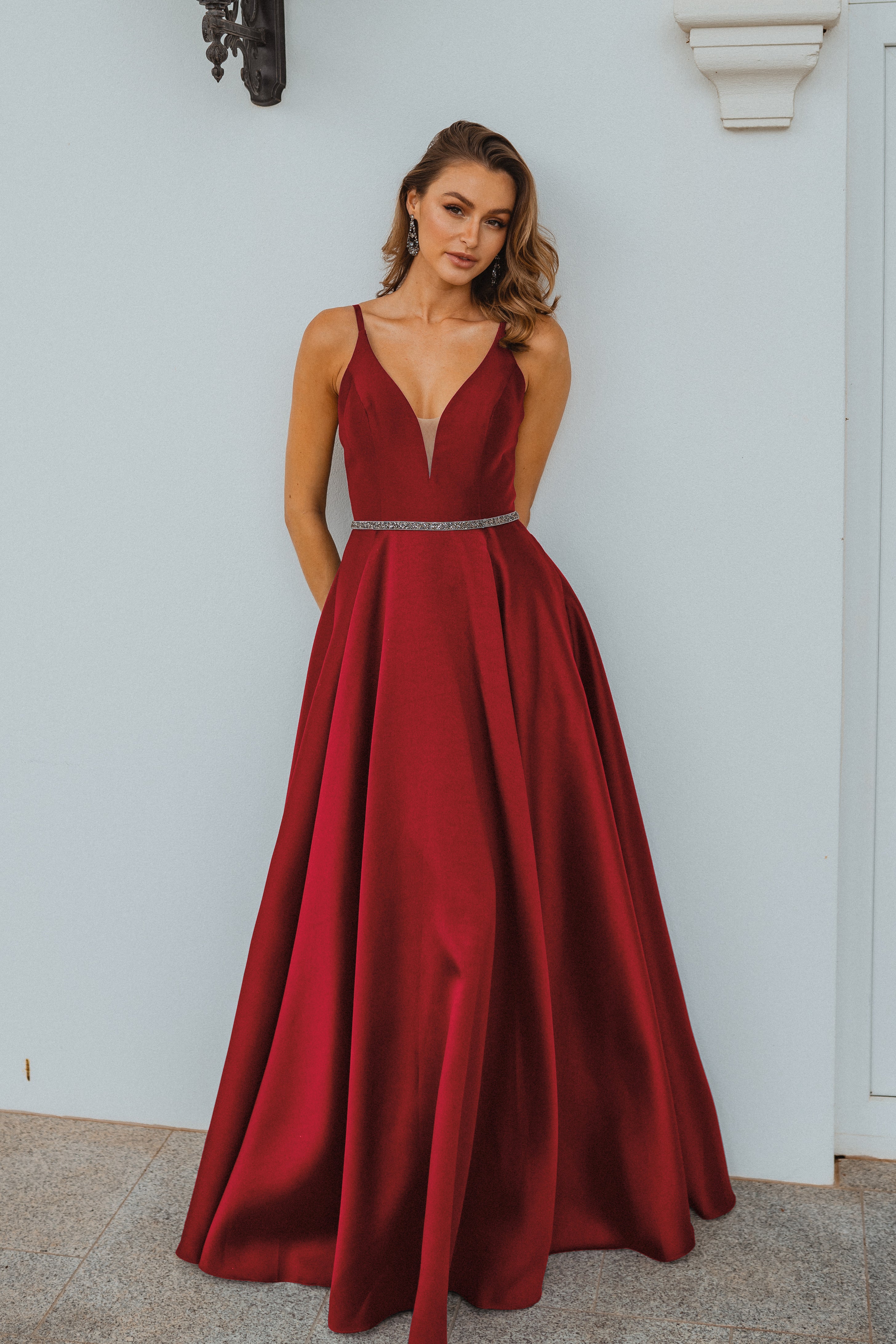 PO896 Linz front of red plunging v neckline, floor length a line, matte satin formal dress